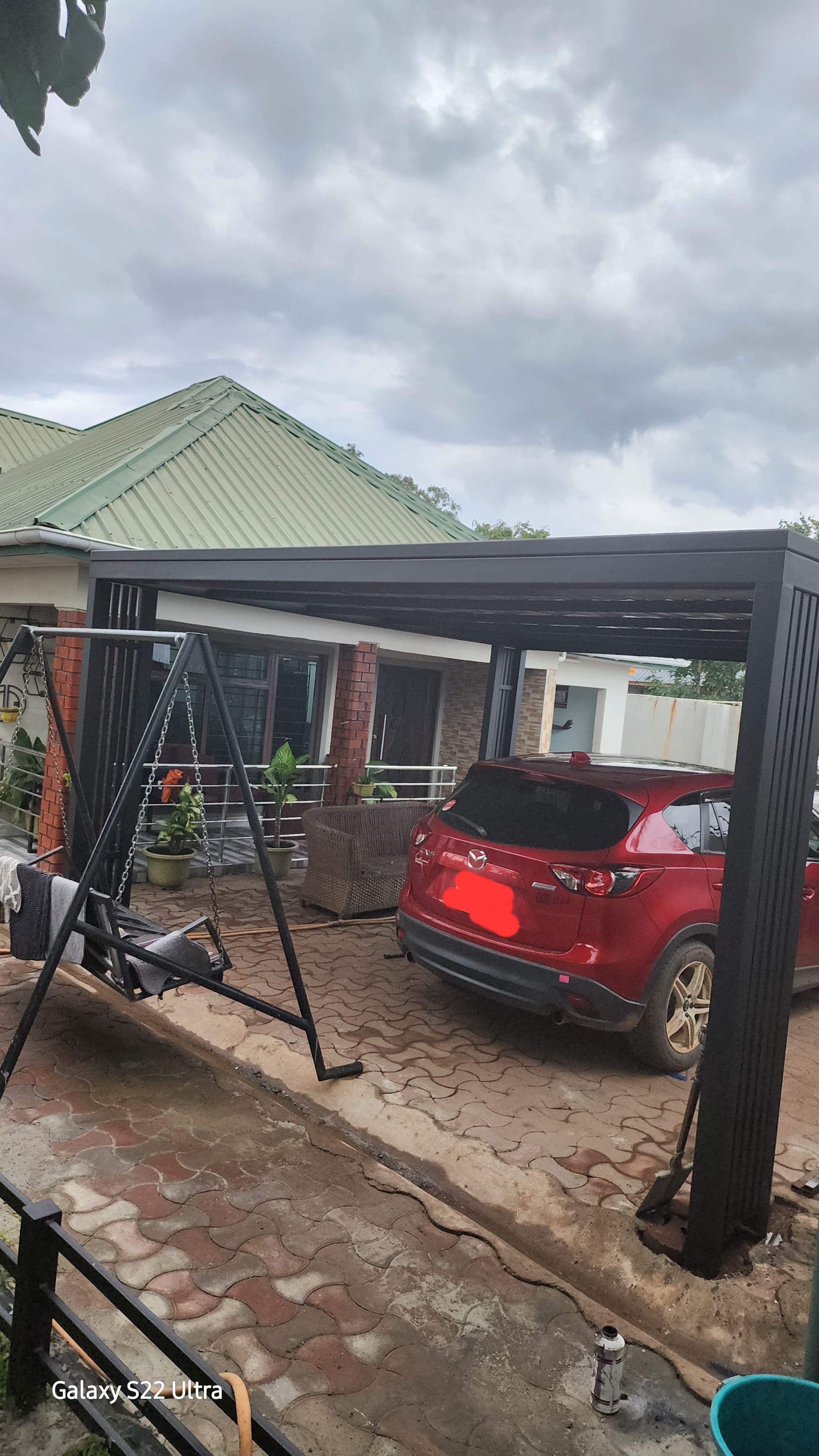 Custom steel pergola and carport shelters for residential and commercial clients